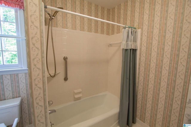 836 Tulip Poplar Dr, Hoover, AL 35244 - bathroom with shower / bathtub combination with curtain, wallpapered walls, plenty of natural light, and toilet