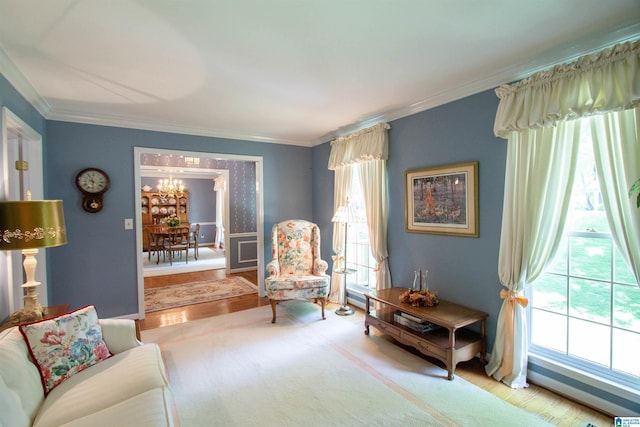836 Tulip Poplar Dr, Hoover, AL 35244 - living room featuring a chandelier, ornamental molding, and wood finished floors