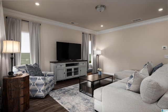 living room featuring visible vents, dark wood-style flooring, and crown molding