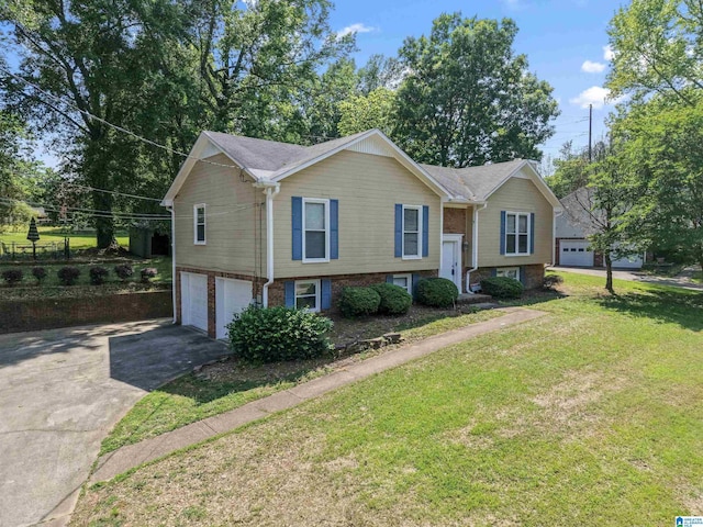 split foyer home with brick siding, an attached garage, a front lawn, and aphalt driveway