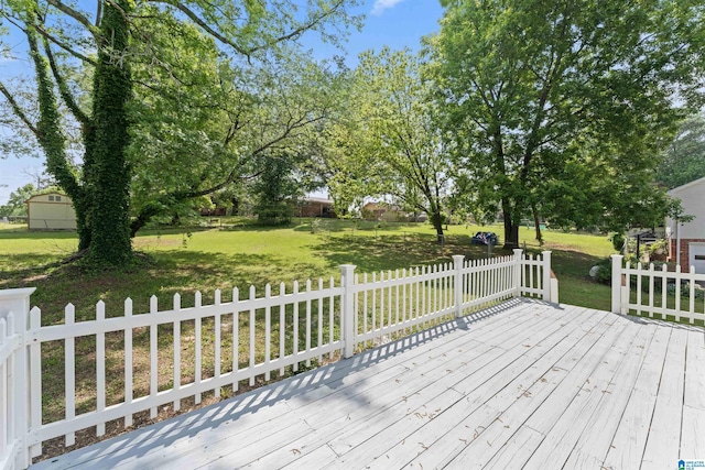 wooden deck with a lawn