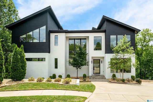 contemporary home featuring stucco siding