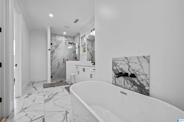 bathroom with a marble finish shower, vanity, marble tiled floors, recessed lighting, and a freestanding bath