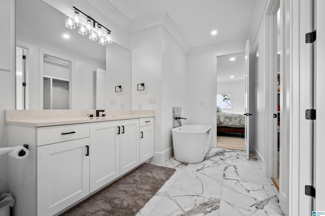 ensuite bathroom with marble look tile flooring, vanity, baseboards, ornamental molding, and recessed lighting