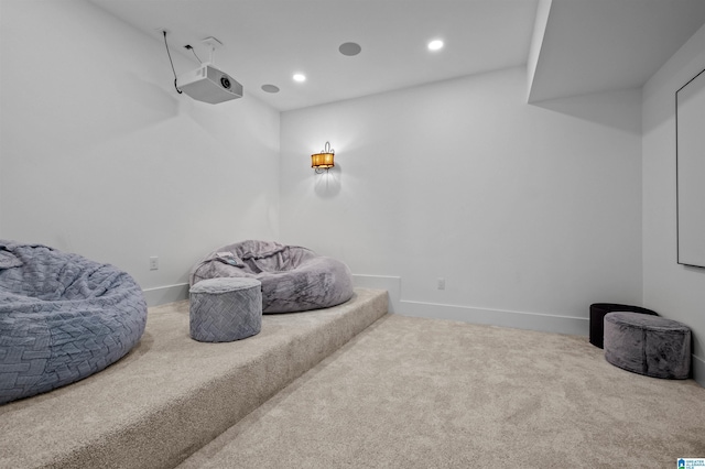 living area with carpet flooring, baseboards, and recessed lighting