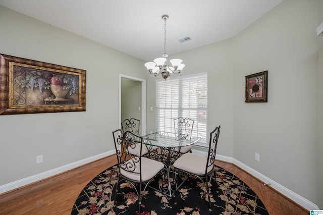 124 Blackstone Ct, Chelsea, AL 35043 - dining space featuring baseboards, an inviting chandelier, wood finished floors, and visible vents