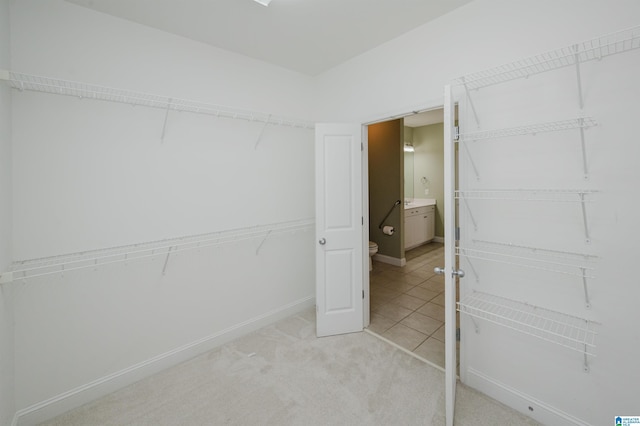 124 Blackstone Ct, Chelsea, AL 35043 - walk in closet featuring light carpet and light tile patterned floors