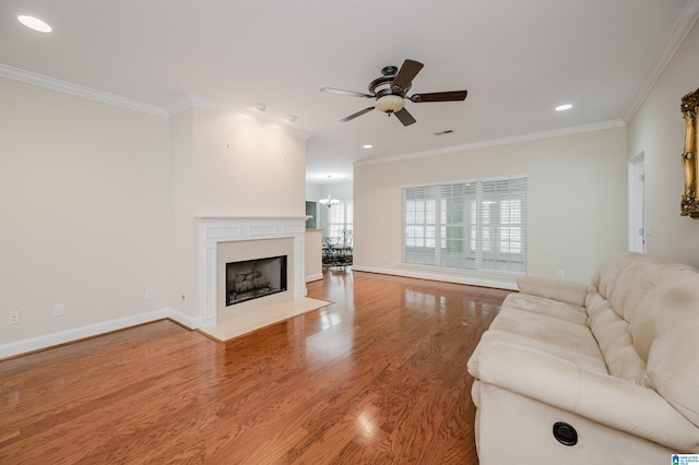 124 Blackstone Ct, Chelsea, AL 35043 - living area featuring ornamental molding, ceiling fan with notable chandelier, and wood finished floors