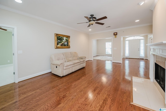 124 Blackstone Ct, Chelsea, AL 35043 - living area with a ceiling fan, a fireplace, baseboards, light wood finished floors, and ornamental molding