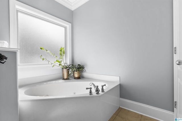 full bathroom featuring baseboards, a tub with jets, ornamental molding, and tile patterned flooring