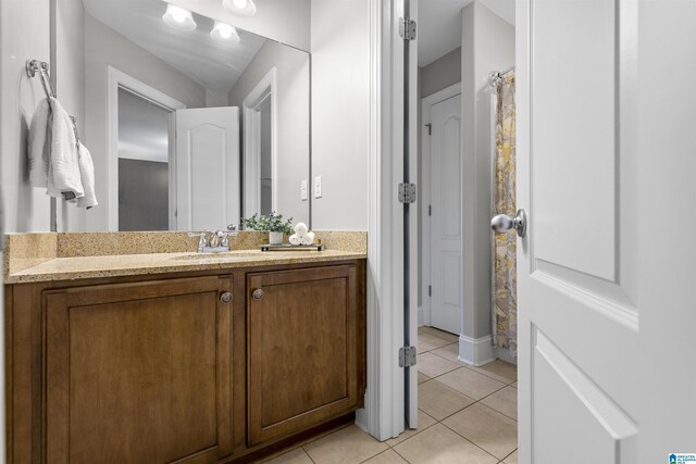 bathroom with vanity and tile patterned flooring