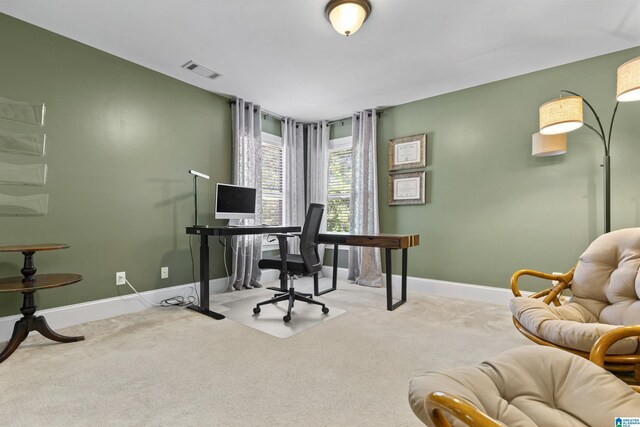office area with carpet floors, baseboards, and visible vents