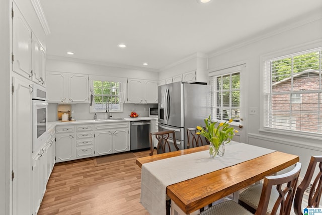 1700 Kestwick Dr, Hoover, AL 35226 - kitchen featuring a sink, appliances with stainless steel finishes, a wealth of natural light, and ornamental molding