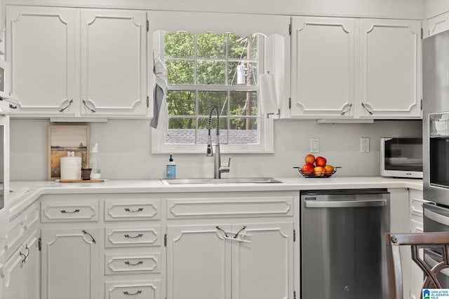 1700 Kestwick Dr, Hoover, AL 35226 - kitchen with white cabinets, stainless steel appliances, and a sink