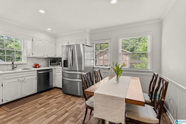 1700 Kestwick Dr, Hoover, AL 35226 - kitchen with white cabinetry, appliances with stainless steel finishes, ornamental molding, and a sink