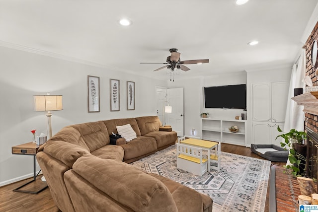 1700 Kestwick Dr, Hoover, AL 35226 - living room featuring a brick fireplace, a ceiling fan, crown molding, and recessed lighting