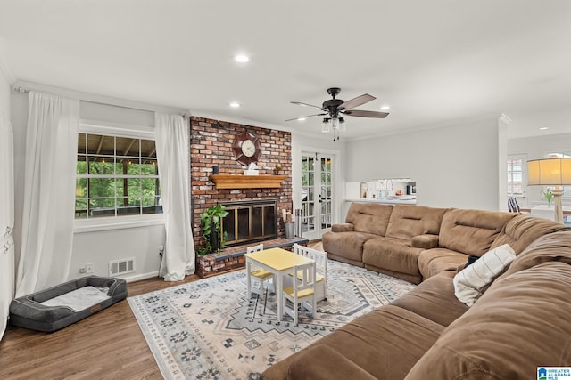 1700 Kestwick Dr, Hoover, AL 35226 - living area with visible vents, crown molding, wood finished floors, ceiling fan, and recessed lighting