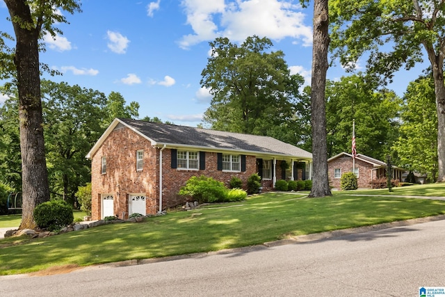 1700 Kestwick Dr, Hoover, AL 35226 - view of front facade with brick siding, an attached garage, and a front lawn