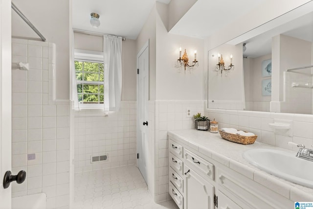 1700 Kestwick Dr, Hoover, AL 35226 - bathroom featuring vanity, a shower, and tile walls