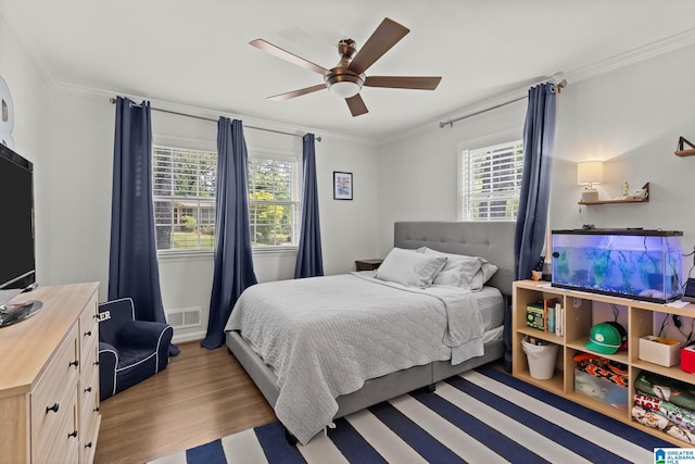 1700 Kestwick Dr, Hoover, AL 35226 - bedroom with visible vents, ornamental molding, ceiling fan, and wood finished floors