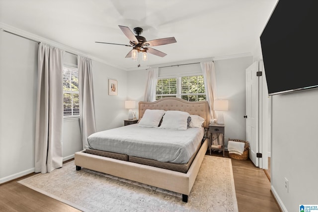 1700 Kestwick Dr, Hoover, AL 35226 - bedroom with baseboards, ornamental molding, a ceiling fan, and wood finished floors