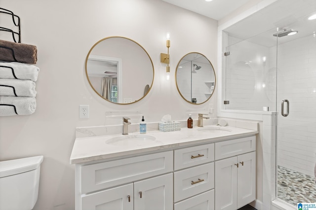 1700 Kestwick Dr, Hoover, AL 35226 - full bath featuring a sink, a shower stall, toilet, and double vanity