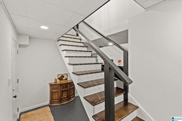 1700 Kestwick Dr, Hoover, AL 35226 - staircase featuring baseboards, recessed lighting, finished concrete floors, and a drop ceiling