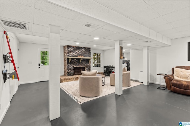1700 Kestwick Dr, Hoover, AL 35226 - living room featuring concrete flooring, baseboards, a brick fireplace, and visible vents