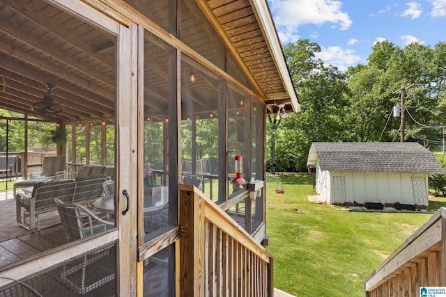 1700 Kestwick Dr, Hoover, AL 35226 - wooden deck with a storage unit, an outdoor structure, a yard, and a sunroom