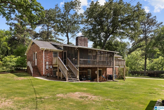1700 Kestwick Dr, Hoover, AL 35226 - back of property with a chimney, a sunroom, brick siding, a lawn, and stairway