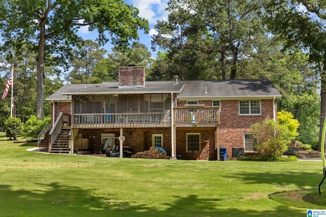 1700 Kestwick Dr, Hoover, AL 35226 - back of property featuring a yard, brick siding, a chimney, and a sunroom