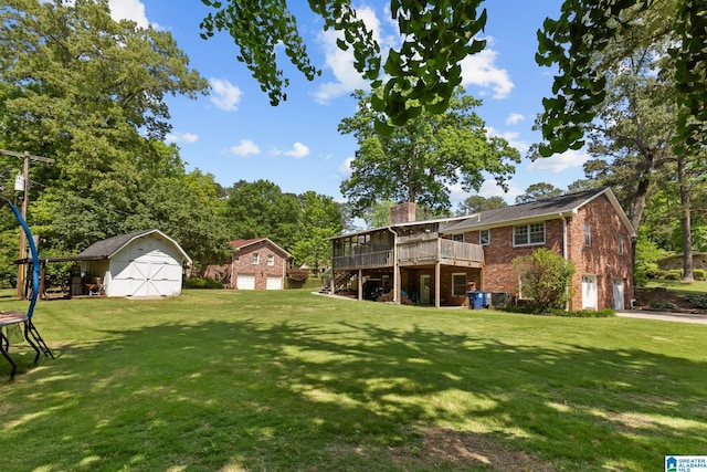 1700 Kestwick Dr, Hoover, AL 35226 - view of yard with a storage shed, an attached garage, a wooden deck, and an outdoor structure