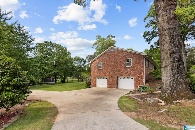 1700 Kestwick Dr, Hoover, AL 35226 - view of side of property featuring a yard, an attached garage, concrete driveway, and brick siding