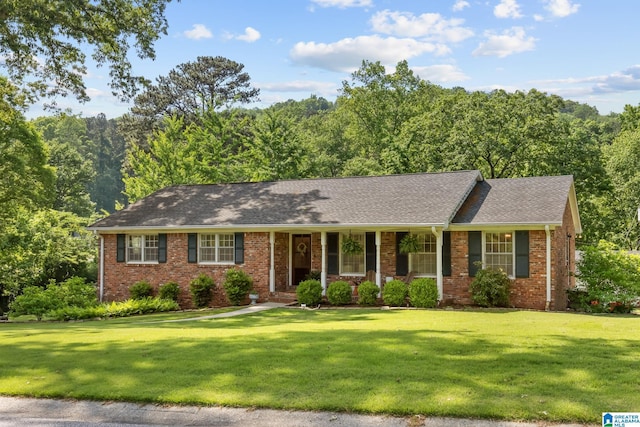1700 Kestwick Dr, Hoover, AL 35226 - ranch-style house with a shingled roof, a porch, a front lawn, and brick siding