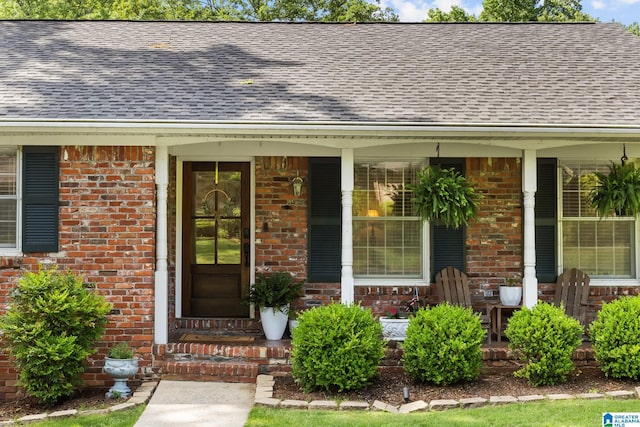 1700 Kestwick Dr, Hoover, AL 35226 - property entrance featuring roof with shingles, covered porch, and brick siding