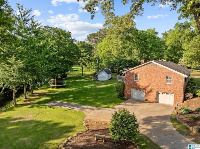 1700 Kestwick Dr, Hoover, AL 35226 - view of home's exterior featuring a chimney, an attached garage, concrete driveway, and brick siding