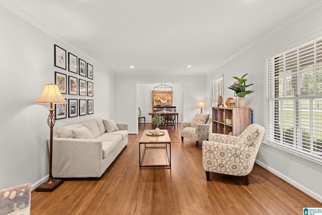 1700 Kestwick Dr, Hoover, AL 35226 - living room with an inviting chandelier, baseboards, crown molding, and wood finished floors