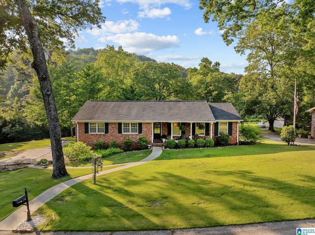1700 Kestwick Dr, Hoover, AL 35226 - single story home with a porch, brick siding, a shingled roof, and a front lawn