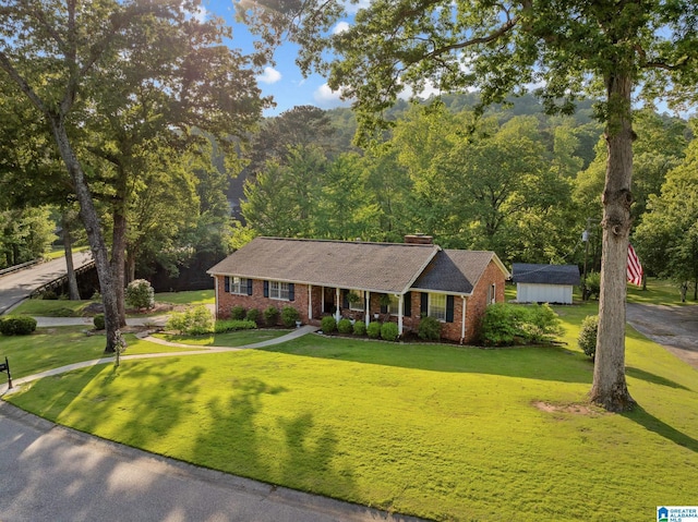 1700 Kestwick Dr, Hoover, AL 35226 - ranch-style house with a chimney, a front yard, brick siding, an outdoor structure, and a storage unit
