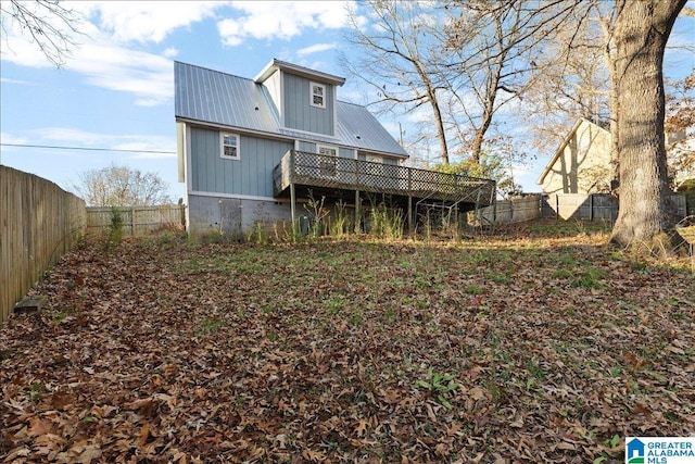 906 Ridgewood Dr, Remlap, AL 35133 - rear view of house with a fenced backyard, a deck, and metal roof