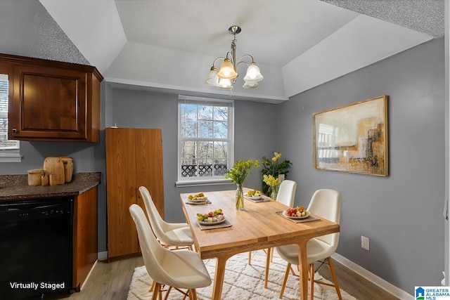 906 Ridgewood Dr, Remlap, AL 35133 - dining room featuring baseboards, a chandelier, lofted ceiling, and light wood finished floors