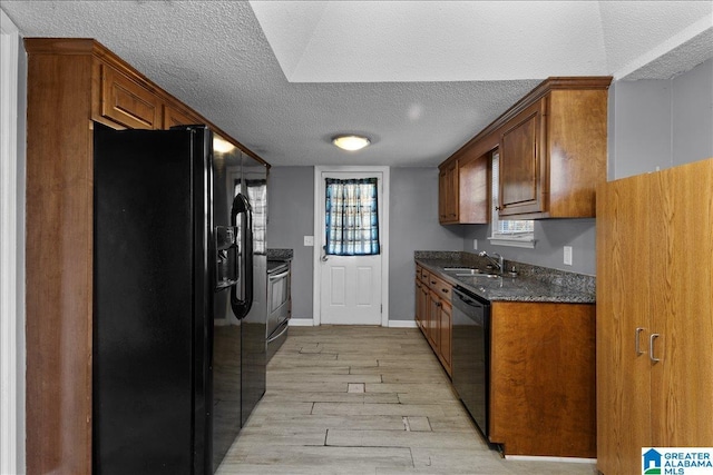 906 Ridgewood Dr, Remlap, AL 35133 - kitchen with light wood-type flooring, a sink, a textured ceiling, and black appliances