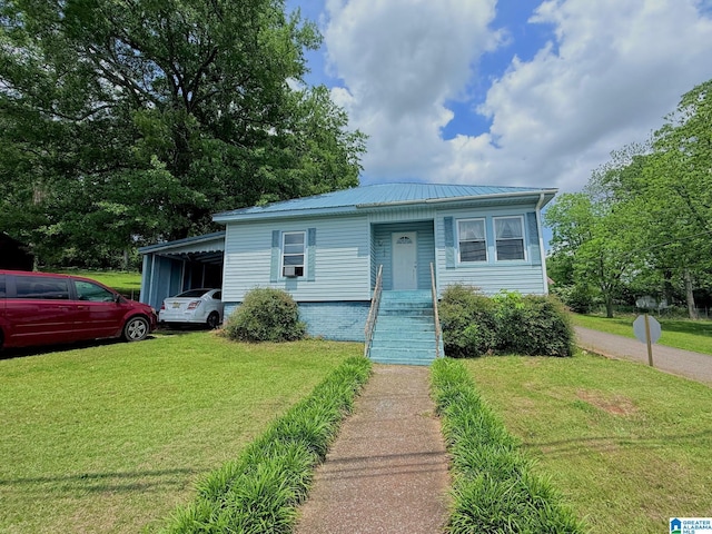 103 Thatcher St, Piedmont, AL 36272 - view of front of home featuring metal roof and a front lawn