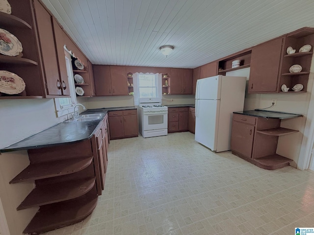 103 Thatcher St, Piedmont, AL 36272 - kitchen with open shelves, a sink, dark countertops, and white appliances