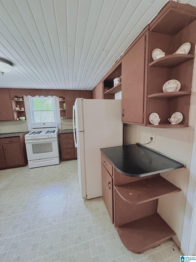 103 Thatcher St, Piedmont, AL 36272 - kitchen featuring open shelves, dark countertops, and white appliances
