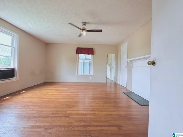103 Thatcher St, Piedmont, AL 36272 - spare room with baseboards, a ceiling fan, light wood-type flooring, and a textured ceiling