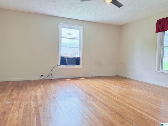 103 Thatcher St, Piedmont, AL 36272 - spare room featuring baseboards, a textured ceiling, light wood-style flooring, and ceiling fan