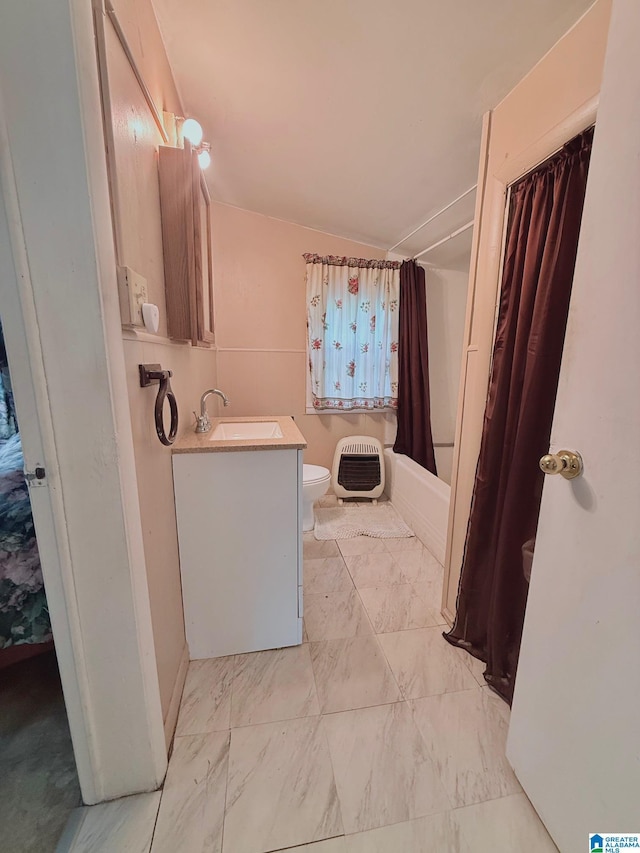 103 Thatcher St, Piedmont, AL 36272 - full bathroom with shower / bath combo with shower curtain, heating unit, toilet, and vanity