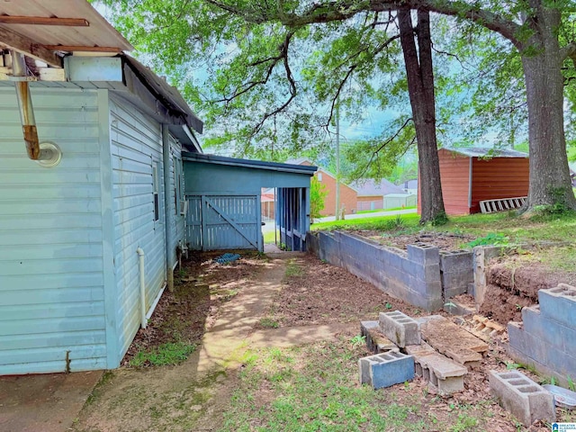 103 Thatcher St, Piedmont, AL 36272 - exterior space featuring a storage shed and an outdoor structure