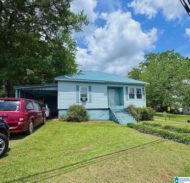 103 Thatcher St, Piedmont, AL 36272 - view of front facade featuring metal roof, a front yard, and a carport